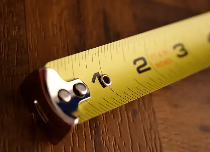 Guides A picture of a measuring tape on a wooden table.