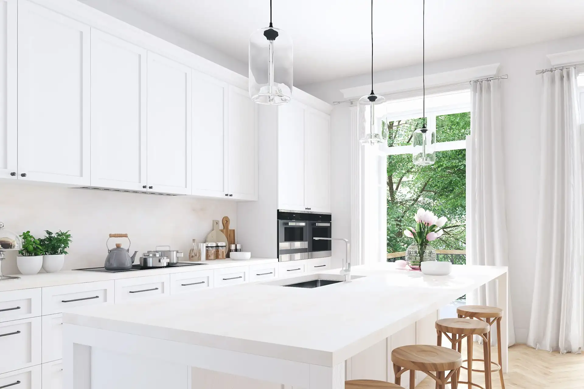 An image of a kitchen with white shaker cabinet doors, wooden bar stools, floor to ceiling grey curtains, and glass pendant lighting over an island.