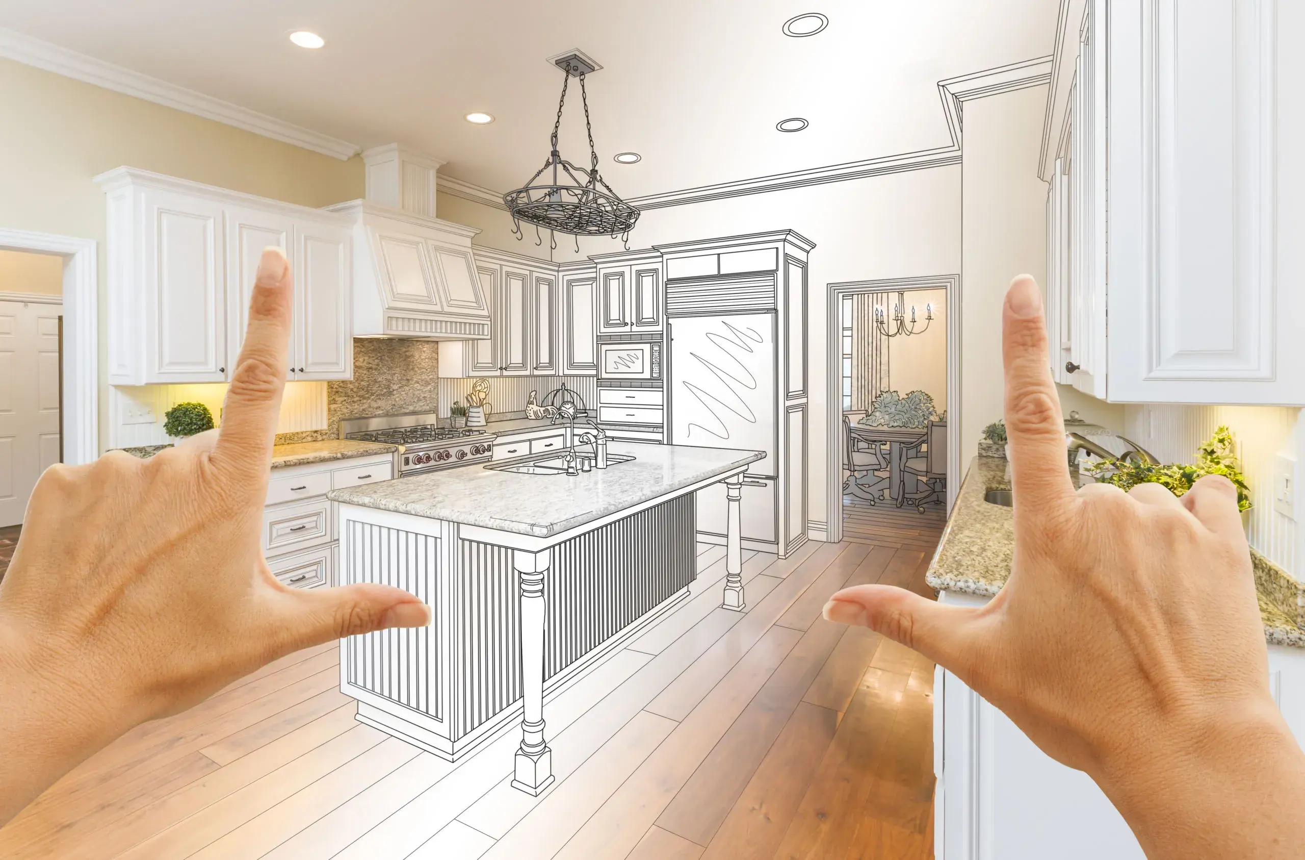 A photo of a computer generated image of a kitchen transitioning into a hand drawn sketch, with hands framing the picture.
