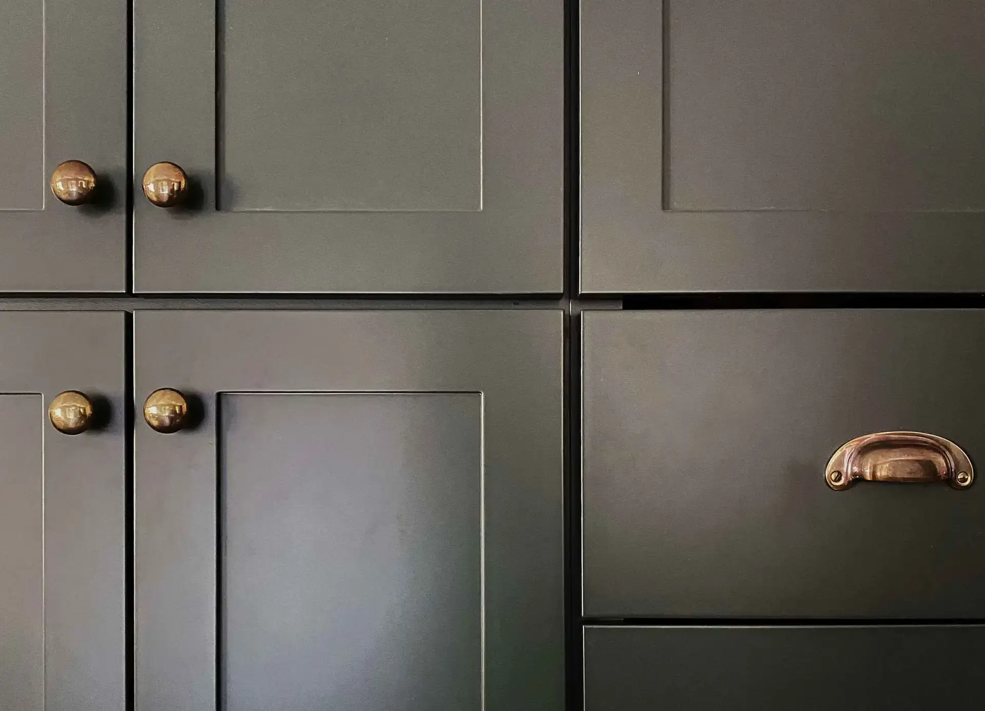 A closeup image of the Angela Rose Slim Shaker cabinet doors in Dream Dusk with brass hardware.
