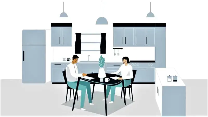 A cartoon image of a couple sitting at a kitchen table surrounded by kitchen cabinetry.