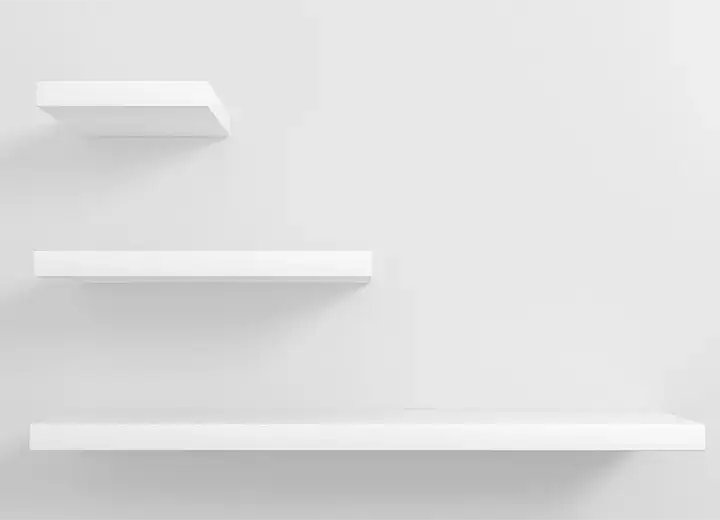 An image of a stack of three white floating shelves.